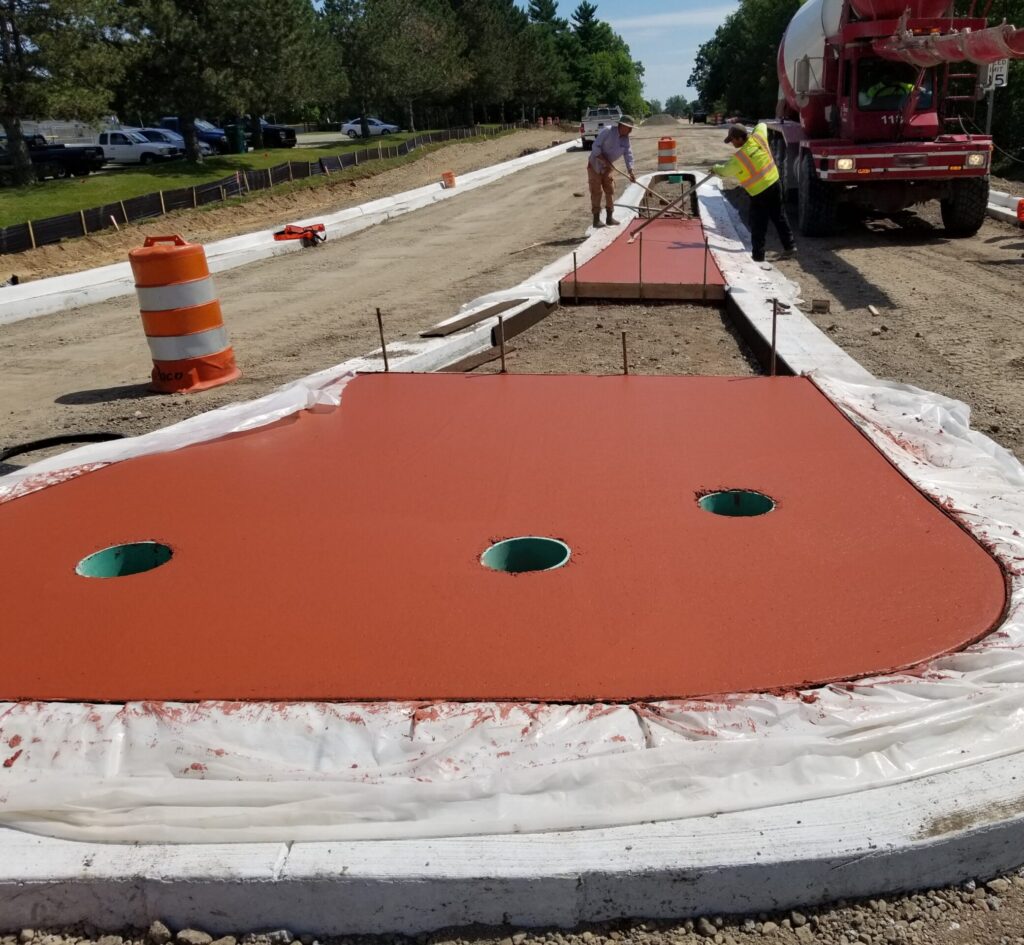 photo of red concrete pour at Textile/Woodland