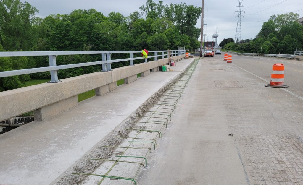 photo of the sidewalk on the bridge after chipping and additional reinforcements