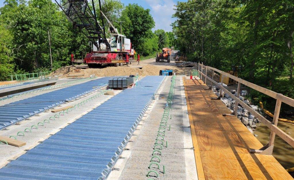 photo of metal forms on the bridge