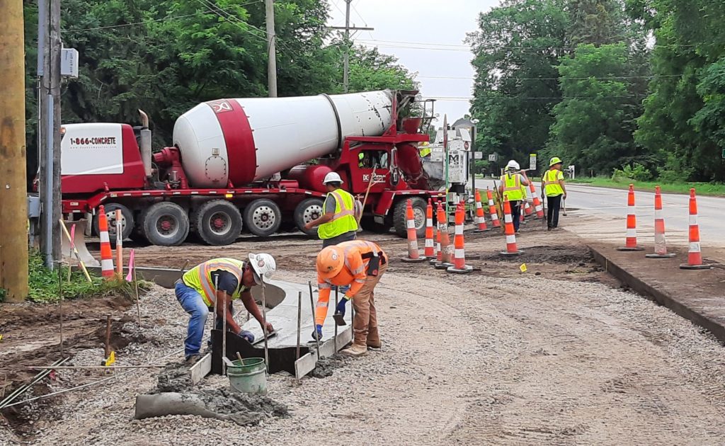 photo of crews working on the curb