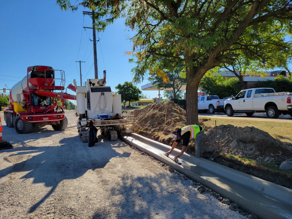 photo of concrete curb being poured