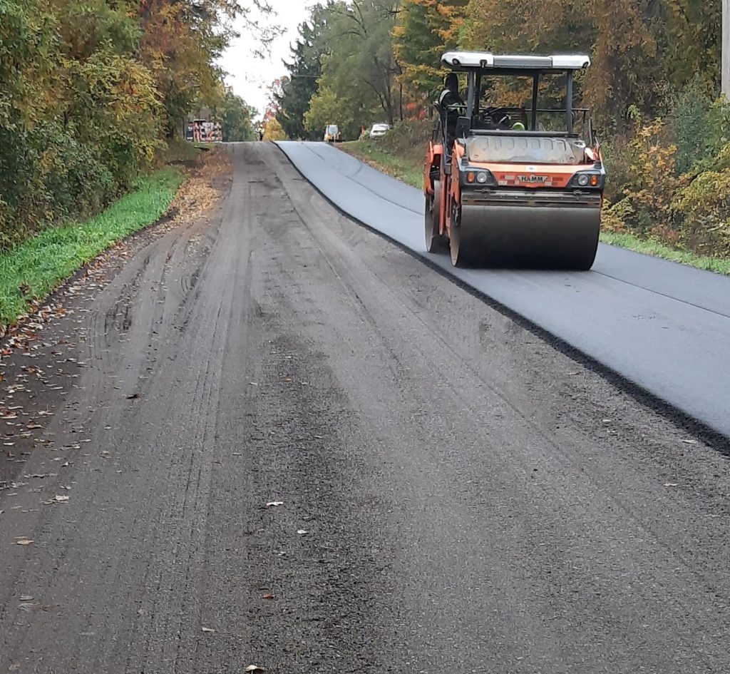 roller working on fresh pavement on Cavanaugh Lake Rd
